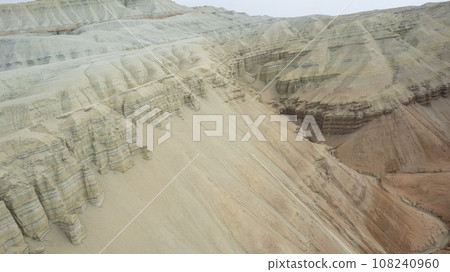 Colorful high mountains and a canyon made of clay Colorful high mountains and a canyon made of clay 108240960