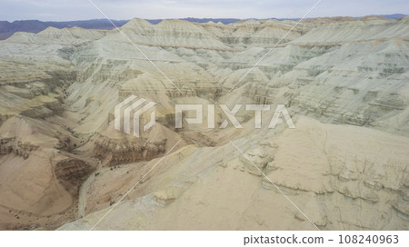 Colorful high mountains and a canyon made of clay Colorful high mountains and a canyon made of clay 108240963