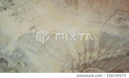 Colorful high mountains and a canyon made of clay Colorful high mountains and a canyon made of clay 108240973