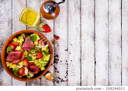 Iberian Ham, Strawberries and vegetables. Restaurant menu, dieting, cookbook recipe top view. 108244011