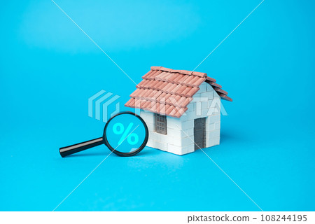 House and money bag with magnifying glass and percent symbol. Remortgage concept. Process of paying off your mortgage with the proceeds from a new mortgage using the same property as security. 108244195