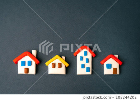 House figures. Realtor services. Find most suitable housing options. Valuation of residential buildings. Offers on real estate market. Copy space, place for text. Buying and selling. 108244202