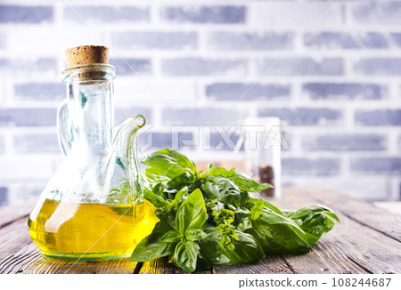 Organic sunflower oil with fresh basil 108244687