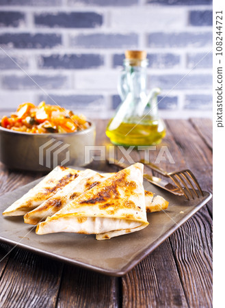 fresh roll of lavash chicken beef with grilled meat mushrooms cheese. 108244721