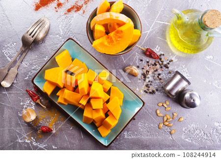 raw pampkin on a table, stock photo raw pampkin on a table, stock photo 108244914