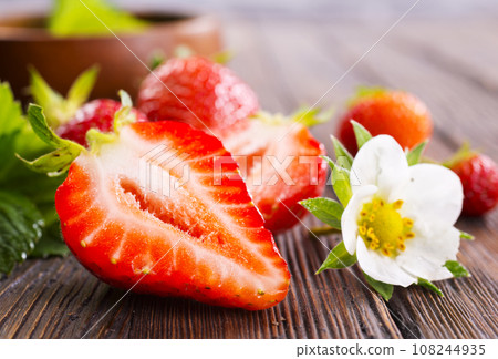 Fresh ripe organic strawberry on wooden table Fresh ripe organic strawberry on wooden table 108244935