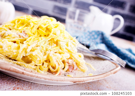 Pasta Carbonara with bacon and parmesan on plate. top view. Copy space Pasta Carbonara with bacon and parmesan on plate. top view. Copy space 108245103