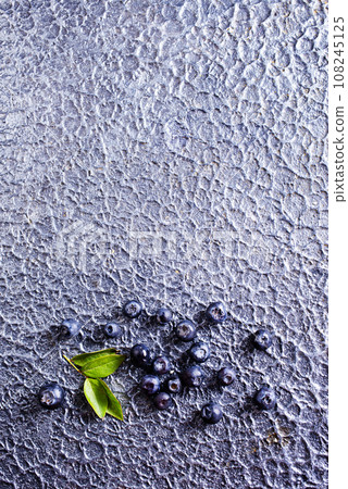Freshly picked blueberries on stone table Freshly picked blueberries on stone table 108245125