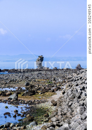 Futagoiwa, a lava tower and rocky landscape with the ocean in the background, a tourist spot in Minamishimabara City, Nagasaki Prefecture Futagoiwa, a lava tower and rocky landscape with the ocean in the background, a tourist spot in Minamishimabara City, Nagasaki Prefecture 108249545