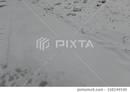 Winter scenery in Yamagata where the road is not visible because it is covered with frozen snow 108249580