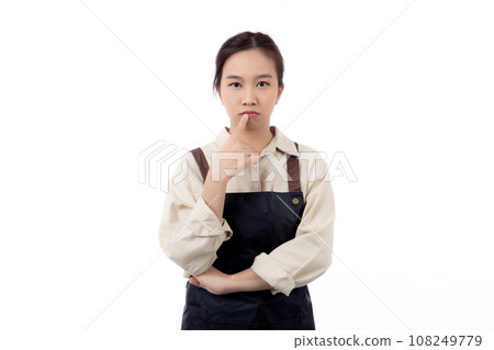 Portrait of young asian barista woman wearing apron gesture doubt and thinking idea isolated. 108249779