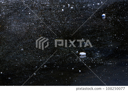 A mass of snow on the frozen pond of Mt. Asahidake in early October 108250077