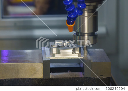 The CNC milling machine rough cutting the aluminum housing with flat end mill tool. The CNC milling machine rough cutting the aluminum housing with flat end mill tool. 108250204