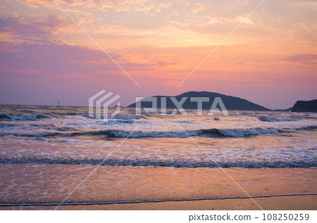 Watching the sunrise from a calm tropical beach, Prachuap, Thailand, Khiri Khan 108250259