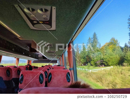 Group of tourist sitting in the bus and looking through the bus windows 108250729