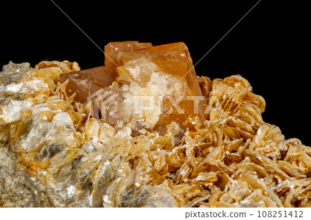Macro Mineral Stone Sheelit on a black background Macro Mineral Stone Sheelit on a black background 108251412