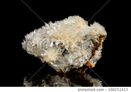 Macro mineral stone crystals Hemimorphite rock on a black background Macro mineral stone crystals Hemimorphite rock on a black background 108251413