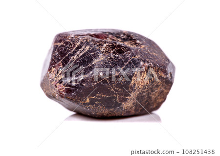 Macro of a mineral garnet stone on a white background 108251438
