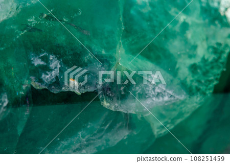Macro mineral stone Fluorite crystal on a black background 108251459