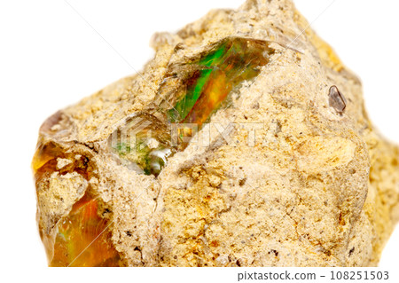 Macro Opal mineral stone in rock on white background Macro Opal mineral stone in rock on white background 108251503