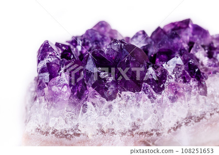 Macro mineral stone purple amethyst in crystals on a white background Macro mineral stone purple amethyst in crystals on a white background 108251653