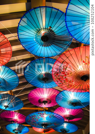 Colorful illuminated Japanese umbrellas 108252104