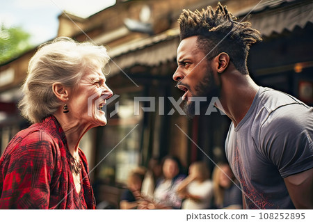 Angry Elderly Gray-Haired Woman and Young Bearded Black Man Arguing Loudly in Public 108252895