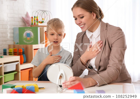 Speech therapist working with little boy in office Speech therapist working with little boy in office 108252949