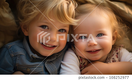 Two little toddler boys having fun in bed before sleeping. Sibiling kids close up portrait 108252977