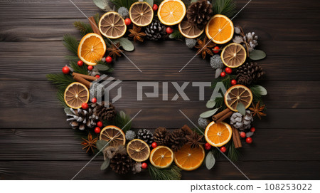 Christmas composition. Wreath made of spices and dry oranges Flat lay, top view, copy space Christmas composition. Wreath made of spices and dry oranges Flat lay, top view, copy space 108253022