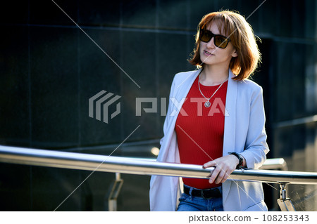 Close-up Portrait of Stylish Redhead Woman in Urban Autumn Fashion Close-up Portrait of Stylish Redhead Woman in Urban Autumn Fashion 108253343
