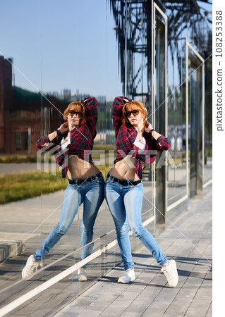 Close-up Portrait of Stylish Redhead Woman in Urban Autumn Fashion Close-up Portrait of Stylish Redhead Woman in Urban Autumn Fashion 108253388