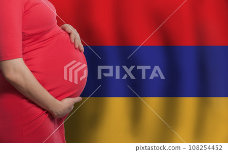 Pregnant woman belly on Armenian flag background Pregnant woman belly on Armenian flag background 108254452