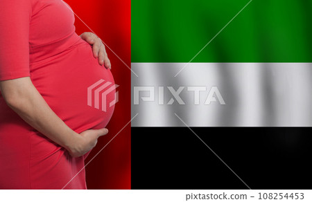 OAE pregnant woman belly on flag of United Arab Emirates background OAE pregnant woman belly on flag of United Arab Emirates background 108254453