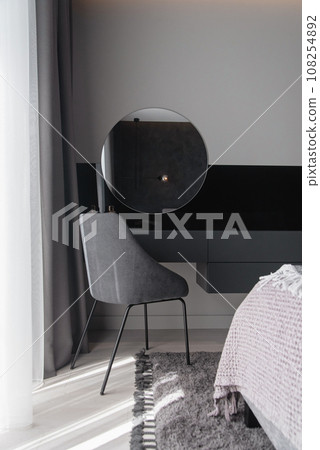 Table and mirror for women make-up in modern grey bedroom in luxury apartment. Table and mirror for women make-up in modern grey bedroom in luxury apartment. 108254892