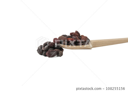 Dogwood or Cornel fruit herb used in herbal medicine on wooden spoon isolated on white background.  Herbs. Alternative medicine. 108255156
