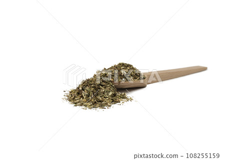 Dry Tansy Herb in latin Tanacetum vulgare on wooden spoon isolated on white background.  Herbs. Alternative medicine. 108255159