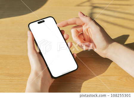 Berlin, Germany October 20 2023 Hand, finger scrolling on mobile phone screen mockup Berlin, Germany October 20 2023 Hand, finger scrolling on mobile phone screen mockup 108255301