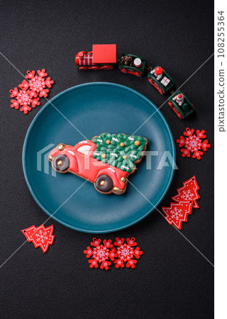 Ceramic round plate decorated with festive elements on the Christmas table 108255364