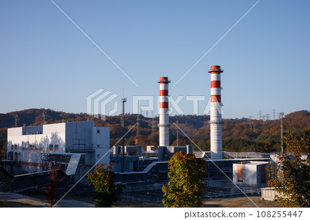 Power plant with two red and white pipes 108255447