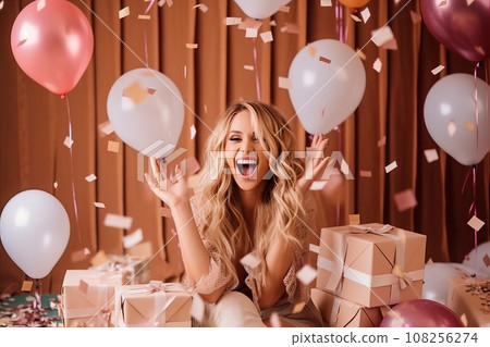 Happy girl on a pink background surrounded by multicolor balloons, gift boxes and confetti 108256274