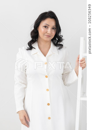 Beautician in the cosmetology office. Cosmetologist indian doctor dermatologist in a beauty clinic. Facial skin treatment. Beauty treatments. 108256349