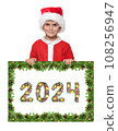 Santa Claus holds christmas poster and 2024 number 108256947