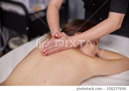 Aromatic Massage, Aroma Therapy, Aromatic Oils. Female client is enjoying aromatic massage with use essential oils at beauty spa. Aromatic Massage, Aroma Therapy, Aromatic Oils. Female client is enjoying aromatic massage with use essential oils at beauty spa. 108257686