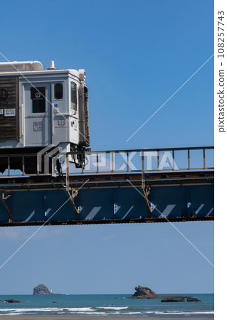 Under the blue sky, the limited express train runs on the iron bridge over the Hosoda River. Under the blue sky, the limited express train runs on the iron bridge over the Hosoda River. 108257743