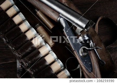 12-gauge break-action smooth-bored shotgun with paper cases. 108259390