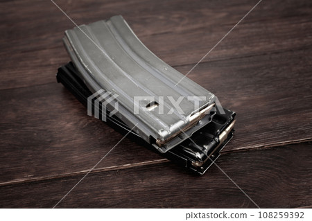 Ammunition with magazine on wooden table Ammunition with magazine on wooden table 108259392