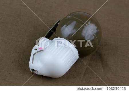 Soviet hand grenade RGN on khaki canvas Soviet hand grenade RGN on khaki canvas 108259413