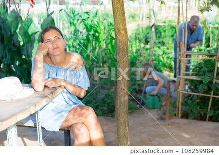 Family working in garden Family working in garden 108259984