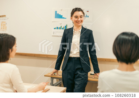 Japanese people listening to explanations from foreign consultants 108260318